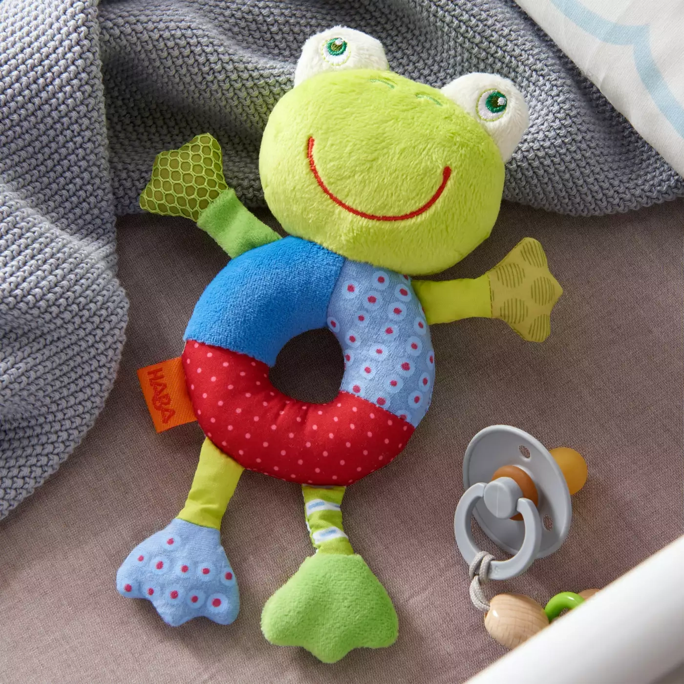 Rasseln & Greiflinge, HABA, Grün – Besonderheit: mit lustiger Rassel im Kopf