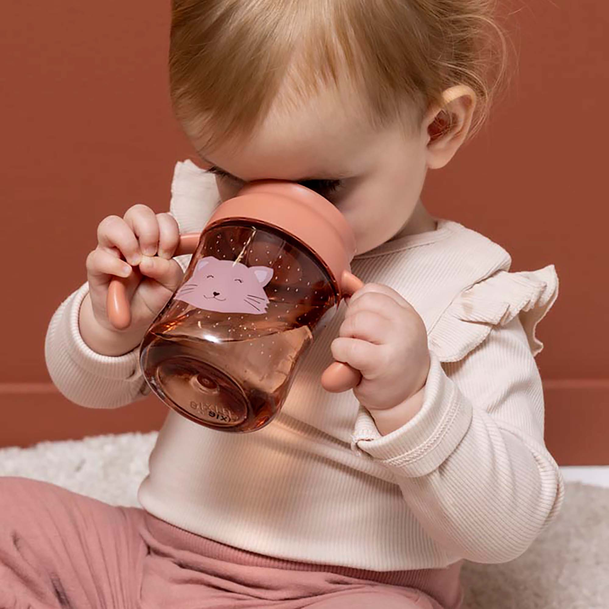 Trinklernbecher & -flaschen, trixie, Pink – Besonderheit: beiden Griffe sind perfekt auf kleine Hände abgestimmt und machen das Halten und Kippen ganz leicht
