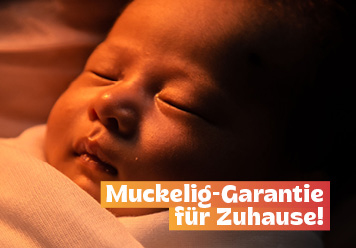 Muckelig-Garantie für Zuhause! Baby in einer Decke.